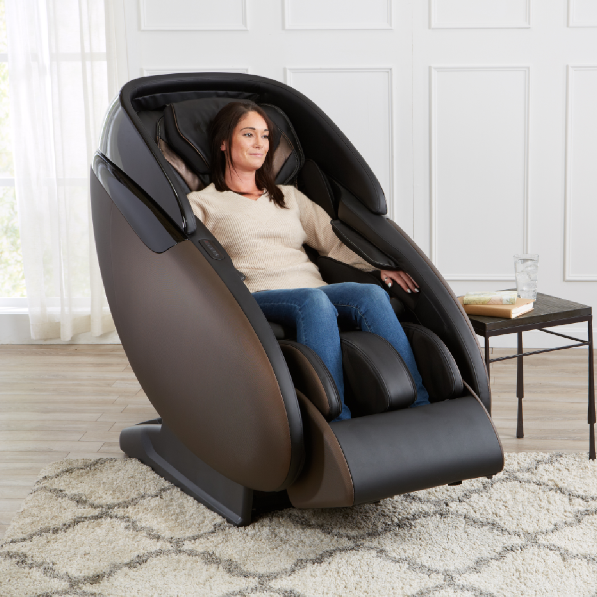 Kyota Kaizen Massage Chair M680 in Brown in interior with a woman sitting in the chair - Home Bars USA