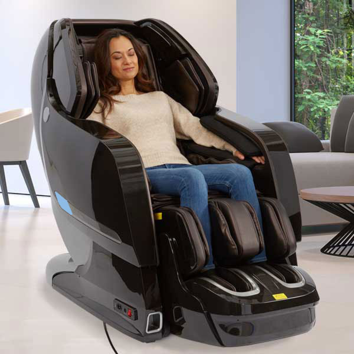 Kyota Yosei 4D Massage Chair M868 in Brown in interior with a woman sitting inside enjoying massage - Home Bars USA