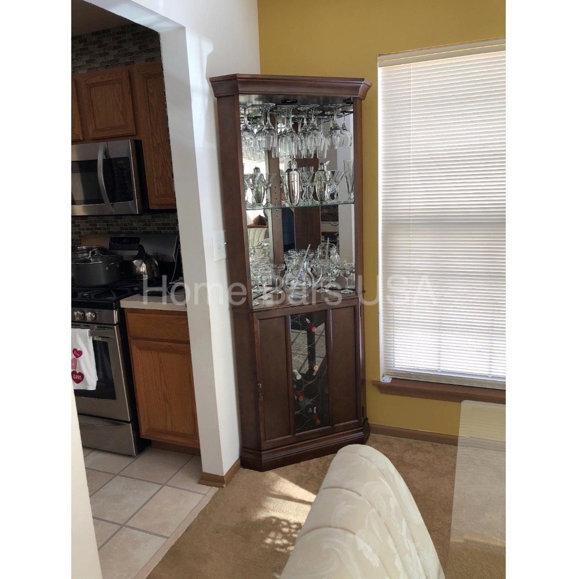 Howard Miller Piedmont III Corner Wine &amp; Bar Cabinet 690007 real from a customer showing front of corner wine bar in home interior - Home Bars USA